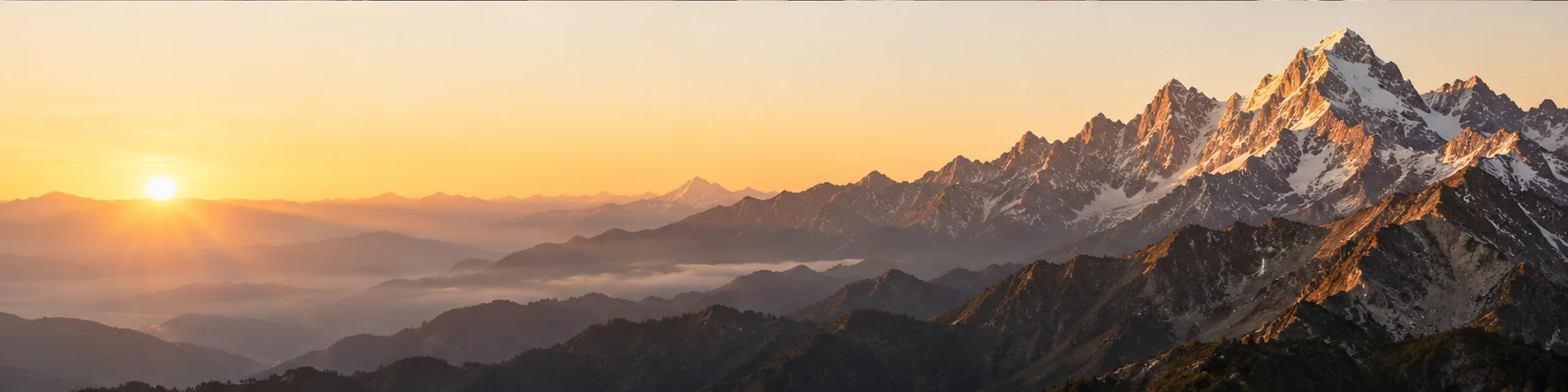 Mountain peaks at golden sunrise